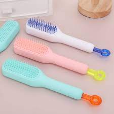 PEINE DE MASAJE AUTOLIMPIANTE